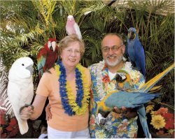 After the tour, we met a retired doctor who takes photographs of his parrots being held by the tourists.  One of the parrots in my left hand likes to play dead!